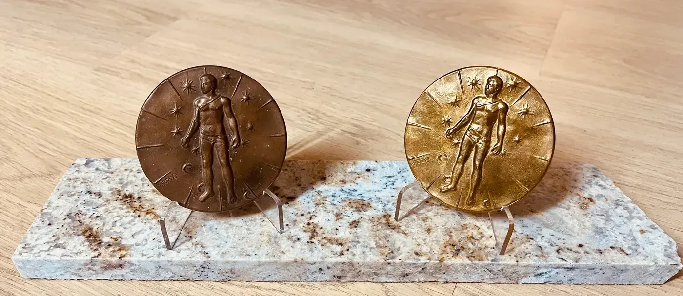 Artcurial Mitoraj medals — both editions, front view