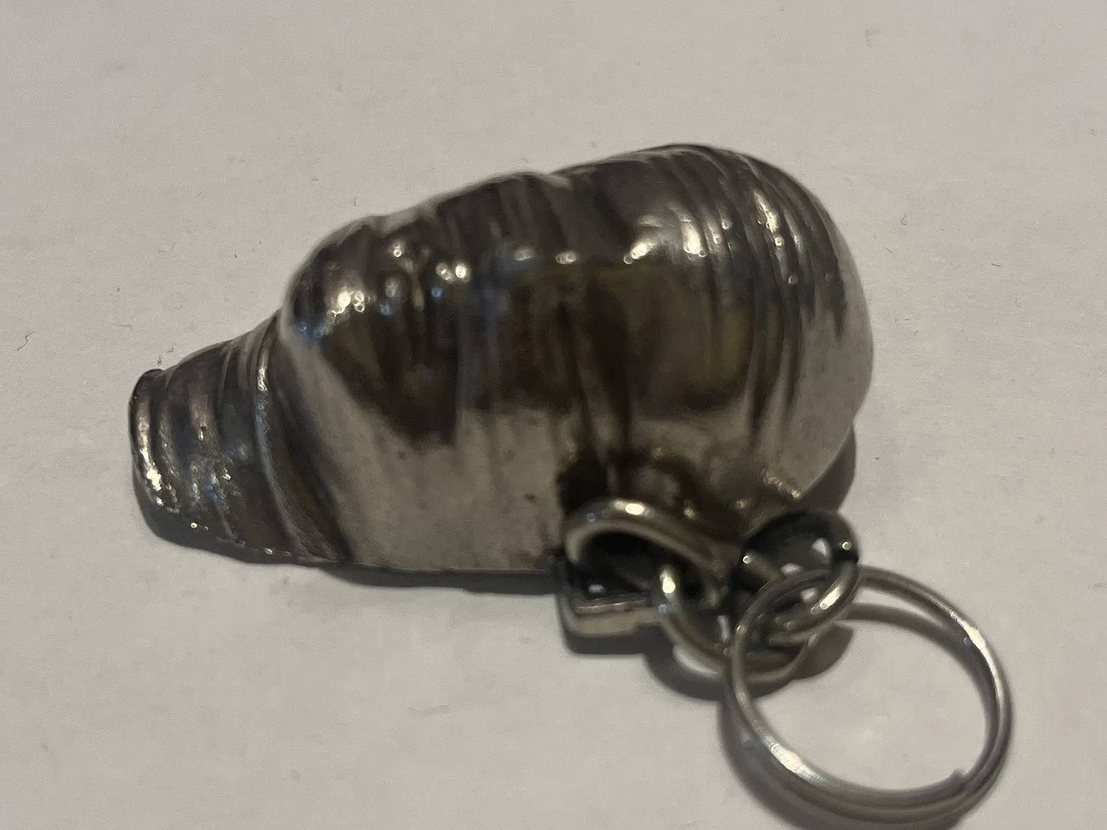 Testa Addormentata — Mitoraj Amnesty International silver pendant close view of bandaged head relief
