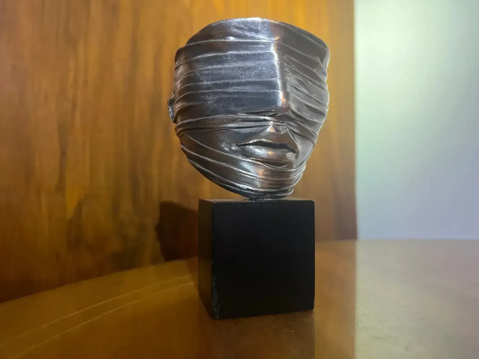 Visage Envoilé — Igor Mitoraj, winding detail close-up — silver-patina bronze head